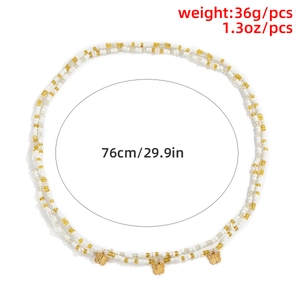 Detailed view of beaded waist chain with gold butterfly charms showing 76cm length specs