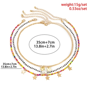 Bohemian kralenketting set met drie lagen en goudkleurige hart- en sterhangers voor zee