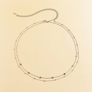 Double-layered silver metal body chain featuring geometric round discs and bead accents