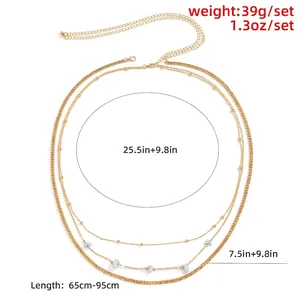 Multi-layer gold body chain with blue stone accents and adjustable extension links