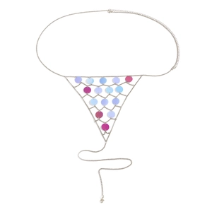 Close-up of silver body chain with colorful sequins and tassel bikini jewelry detail