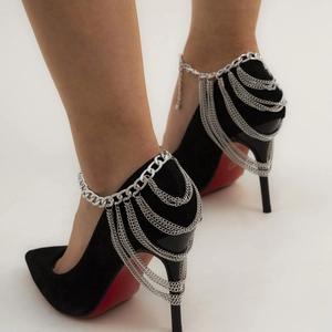 Black suede pointed-toe high heels with multilayer silver chain tassel anklet and red soles