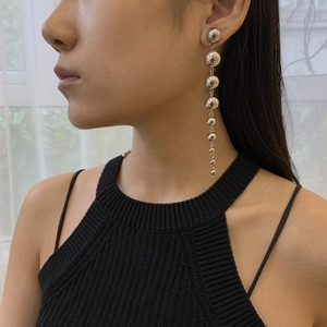 Modern minimalist silver metal beaded drop earrings featuring seven graduated spheres