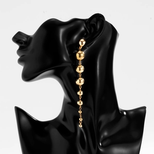 Modern gold bead drop earrings with eight polished spheres in a gradient design