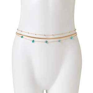 Close-up of a three-layer gold waist chain featuring a flat curb link and turquoise stones
