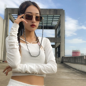 Fashionable PU leather glasses chain with geometric sunglasses accessory worn by a model