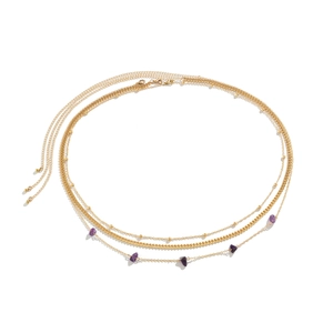 Close-up of gold layered chain belt featuring purple gravel stones and beads