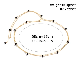 Detail view of double-layer gold waist chain with black stones and sizing specifications