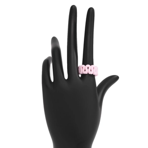 Detailed view of light pink wavy resin ring on a hand model with minimalist geometric design
