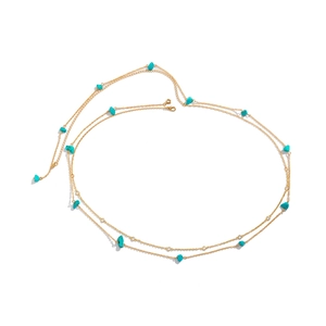 Close-up of gold waist chain featuring turquoise gravel stones and lobster clasp detail