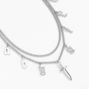 Layered silver chain necklace featuring alloy alphabet letters and a sword pendant detail