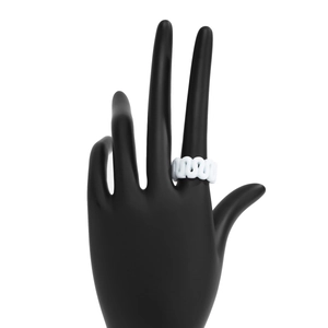 Close-up of a white wave-shaped minimalist ring on a black hand model display