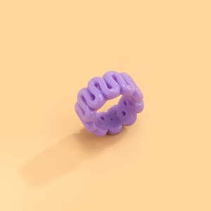 Minimalist purple wavy resin wide ring with glossy geometric texture on pink background