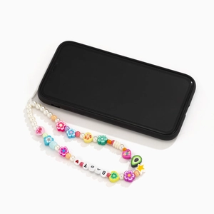Detail of colorful fruit-themed beaded phone strap with 'BABY' letters on a smartphone
