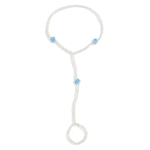 Detail of beaded hand chain featuring pink and blue flower motifs on white background