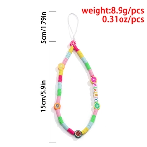 Detail of colorful fruit beaded phone strap with BABY letters and clay flower charm