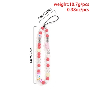 Macro shot of colorful beaded phone strap with floral charms and BABY letter beads