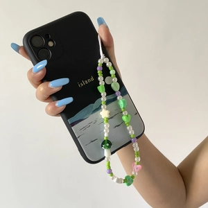 Black iPhone case with island design and colorful handmade beaded mushroom wrist strap