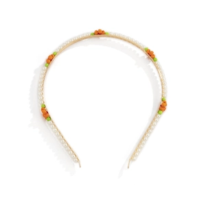 Detail of floral pearl headband with colorful beads on a slim gold metal frame