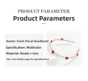 Detail view of woven daisy headband with white beads and red floral accents on gold frame