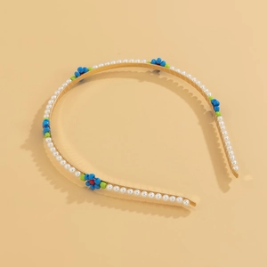 Detailed view of floral beaded headband featuring faux pearls and colorful bead flowers