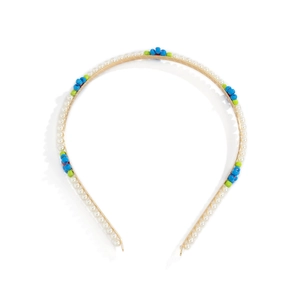 Detail of floral beaded headband with white pearls and colorful flower accents