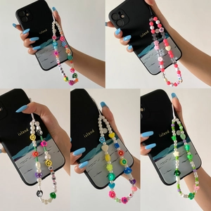 Colorful floral polymer clay beaded phone straps with faux pearls and charm accents