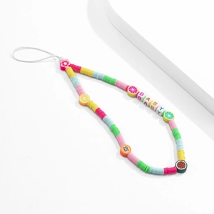 Close-up of colorful polymer clay fruit beads and BABY letter beads phone strap