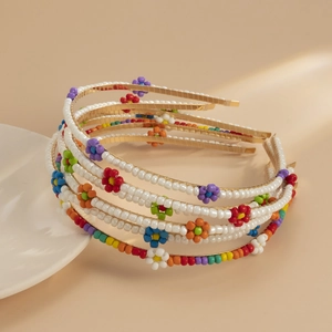 Five-piece set of woven daisy headbands with colorful handmade beads on metal frames