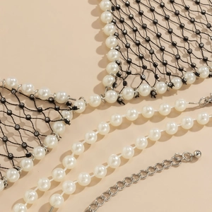 Close-up of faux pearl and rhinestone mesh body chain showing intricate beaded craftsmanship