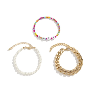 Three-piece layered bracelet set with gold Cuban chain, faux pearls and colorful beads