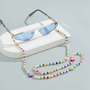 Colorful beaded glasses chain with star charms and faux pearls on blue sunglasses