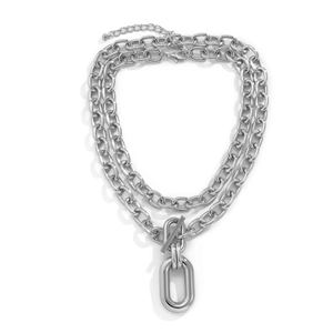 Detail view of multi-layered silver aluminum chain necklace with OT buckle and oval pendant