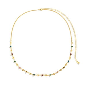 Detail of gold body chain with colorful enamel heart charms and adjustable lobster clasp
