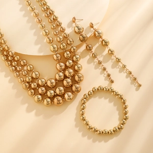 Detailed set of triple-layered golden bead necklaces with matching linear drop earrings