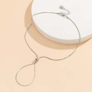 Detail of adjustable silver snake chain anklet showing the S925 clasp and slider