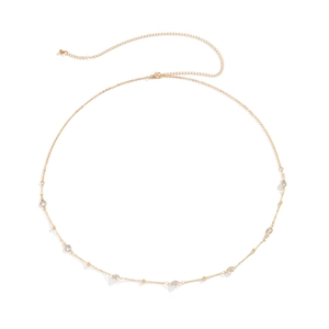 Detail of a gold double-layer chain waist belt featuring sparkling round crystals