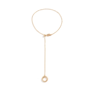 Detail of adjustable gold-plated finger bracelet with ball chain and lobster clasp