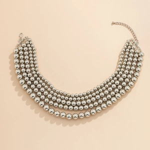 Detail of five-layer silver beaded necklace with polished finish and lobster clasp closure