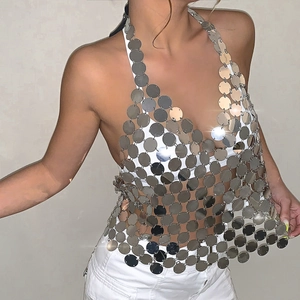 Close-up of sparkling silver metal disc chain top for disco party and festive club wear