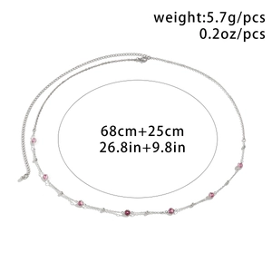 Detail of silver body chain featuring pink rhinestones and adjustable lobster clasp