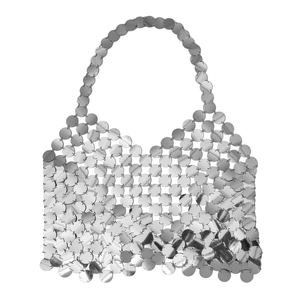 Detail of silver metallic disc tote bag showing reflective sequin scales and handle