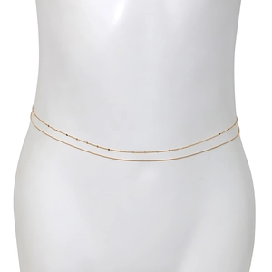 Detailed close-up of a double-layered gold waist chain featuring small round shiny sequins