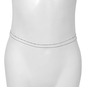 Close-up of double-layer silver body chain with sequins and snake chain on a model