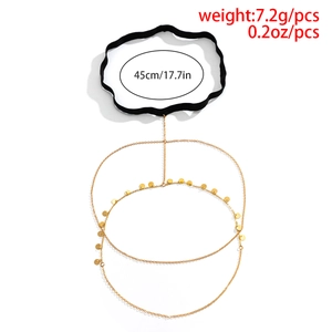 Detail of bohemian gold thigh chain with small disc pendants and elastic band size info