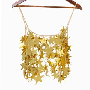 Detail of gold star sequin body chain vest with hollow star-shaped mirror sequins