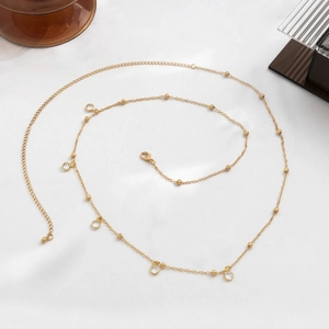 Catena da vita dorata con maglie a perle e pendenti di cristallo tondi lucenti