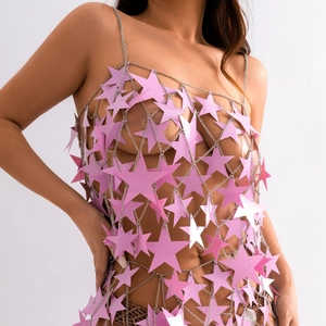 Detailed view of pink star sequin body chain with metallic fringe and hollow out design