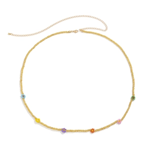 Detail of colorful daisy bead waist chain with golden seed beads and lobster clasp