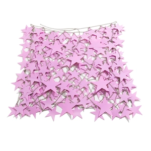 Detailed view of pink star sequins and silver chains on a hollow out body chain jewelry